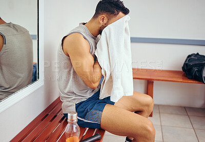 Buy stock photo Man, fitness and towel with face for break, rest or recovery from sweat, training or workout in locker room at gym. Young male person wiping on bench after exercise, shower or routine at health club