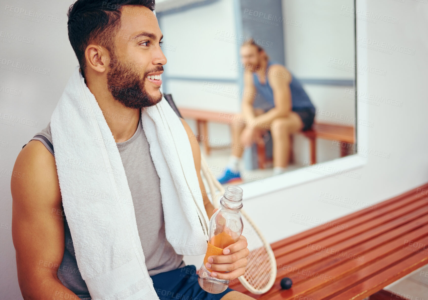 Buy stock photo Happy man, fitness and relax with bottle water for break, recovery or gym talk in locker room. Young male person with smile or squash player rest after workout, exercise or training at health club