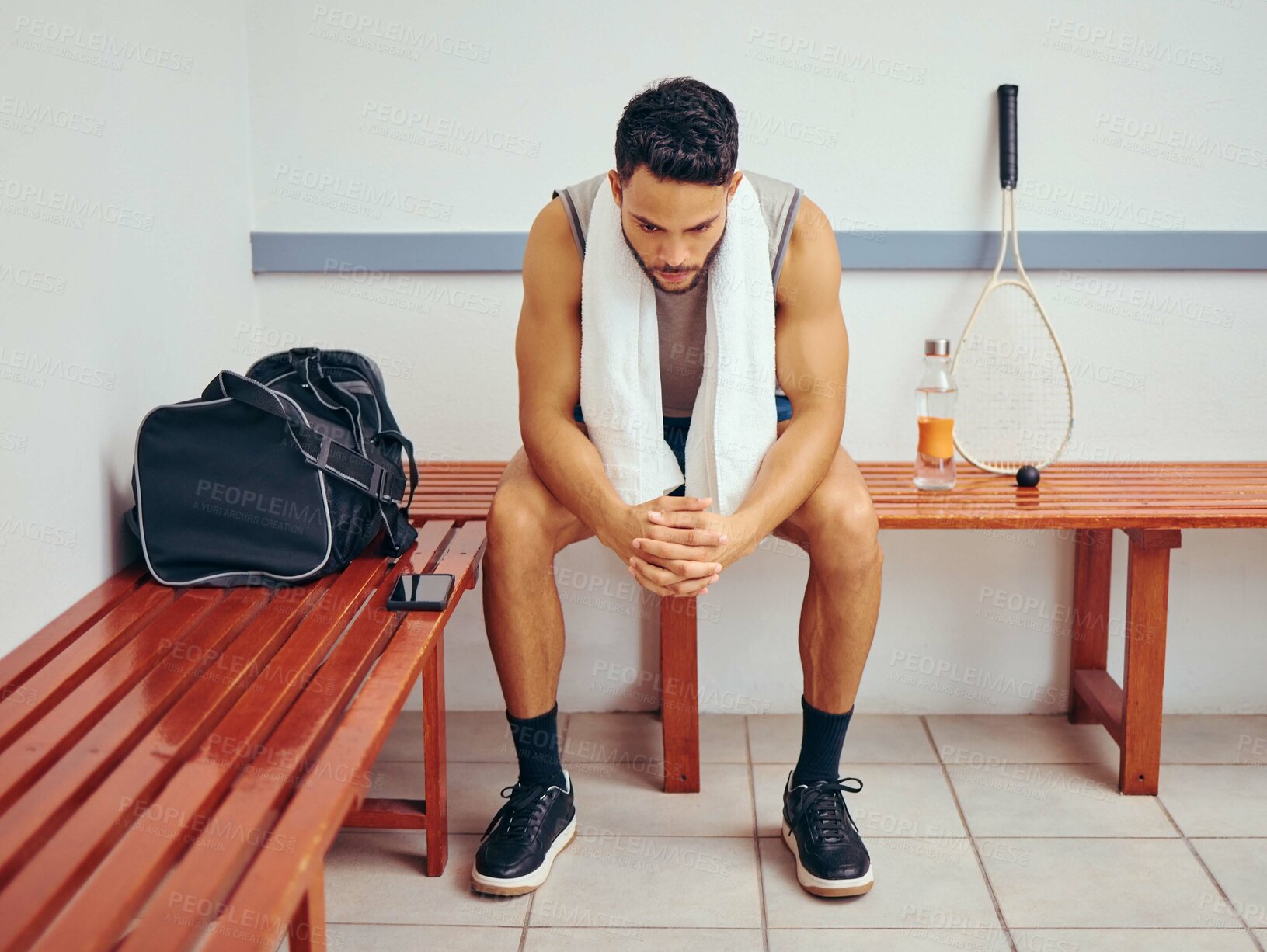 Buy stock photo Tired, towel and man in locker room, fitness and squash player with bag, serious and exhausted in gym and healthy. Concentration, relax and practice of sports for athlete, commitment and thinking