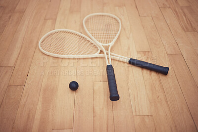 Buy stock photo Court, surface and racket with ball for squash, competition and match for professional athletics. Indoor sports, rubber and wooden floor with equipment for serving, grip tape and playing for game