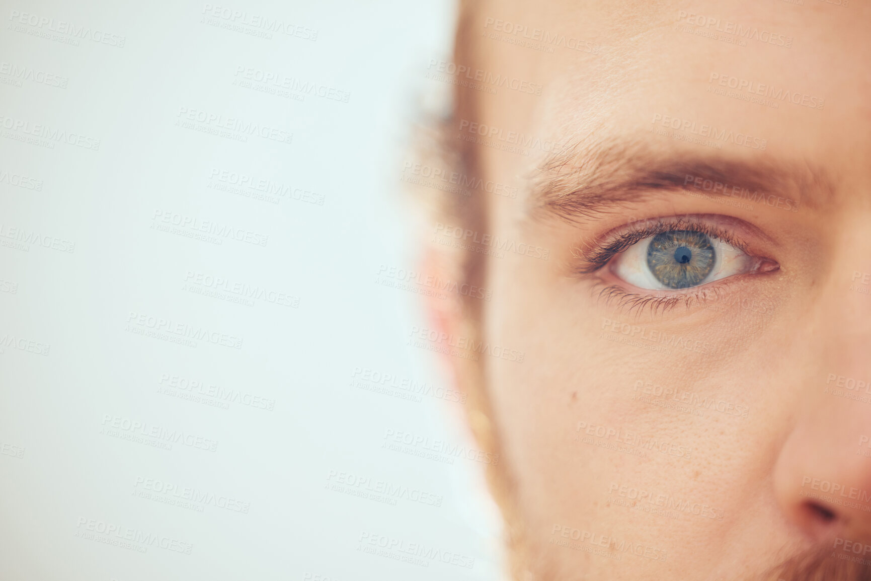 Buy stock photo Half face, closeup and eye of man in studio isolated on white background mockup space. Portrait, vision and zoom on person for eyesight, optometry and contact lens for healthy iris or wellness