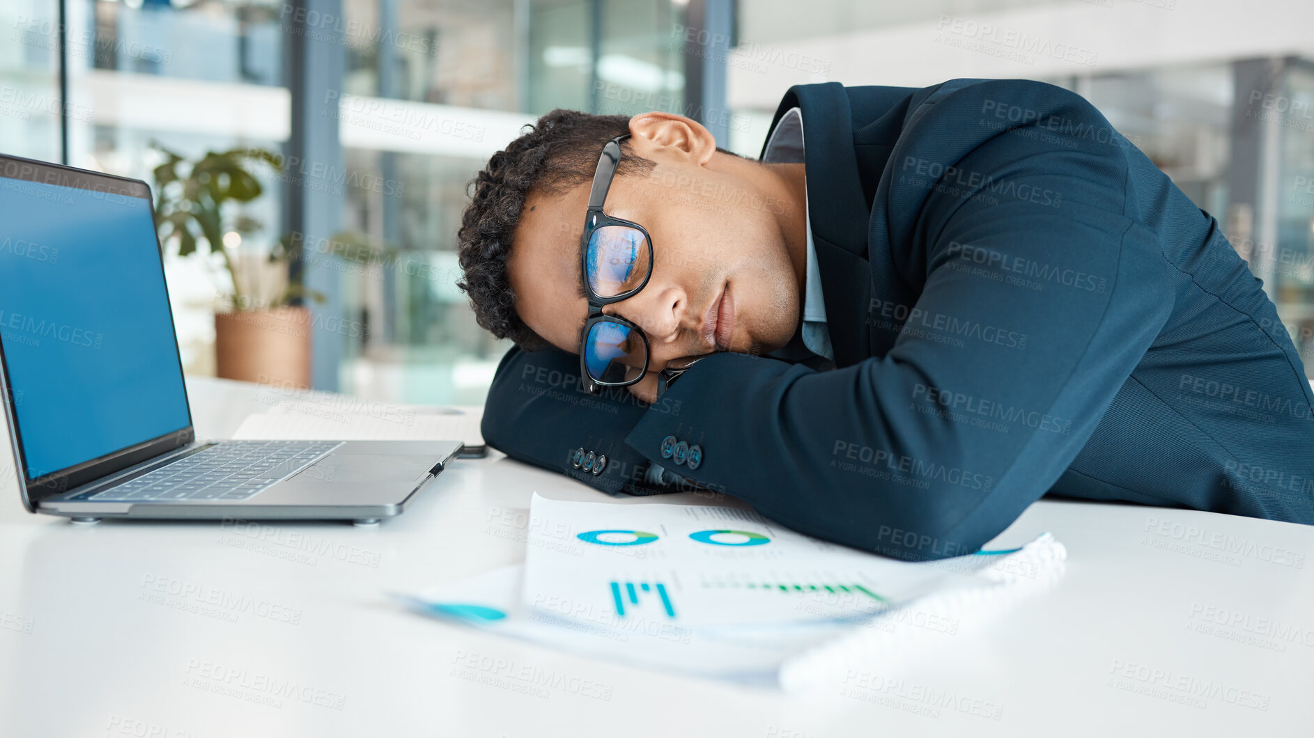 Buy stock photo Laptop, sleeping and tired on desk, man and fatigue of overtime, nightshift and accountant. Office, exhausted and burnout of bookkeeping, overwork and person with graph in agency and rest with nap