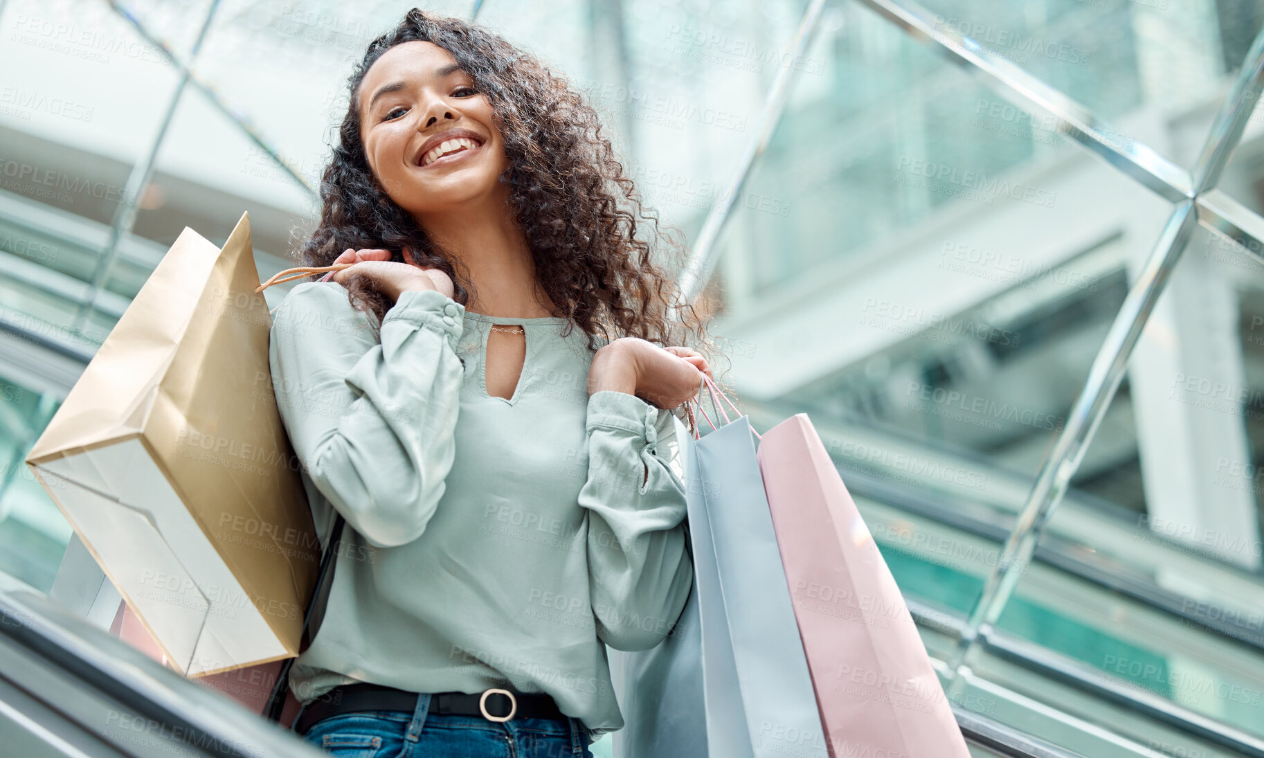 Buy stock photo Happy woman, portrait and escalator with shopping bags for discount sale, purchase or buying spree at mall. Young female person or shopper with smile or gifts for bargain, fashion or spending money