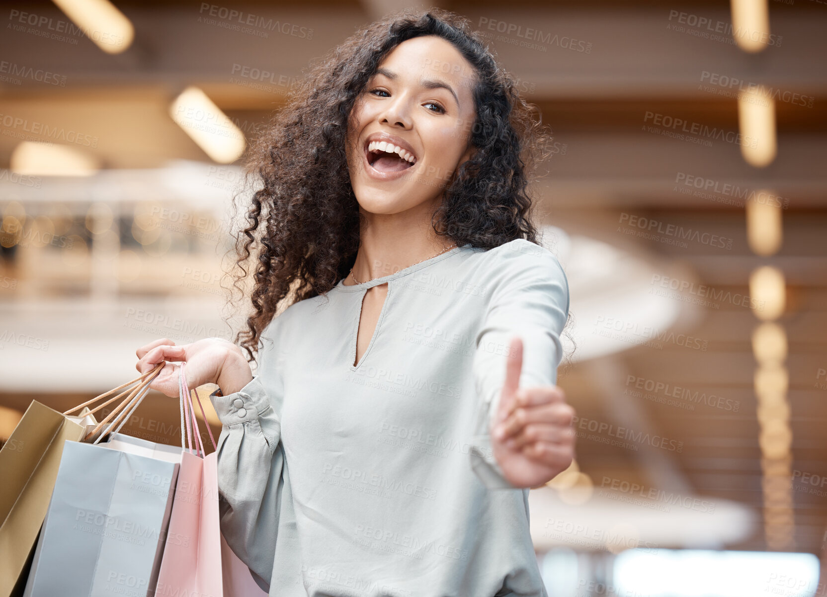 Buy stock photo Excited woman, portrait and shopping bags with thumbs up on purchase, buying or discount sale at mall. Happy female person or shopper with smile, like emoji or yes sign in satisfaction or good review