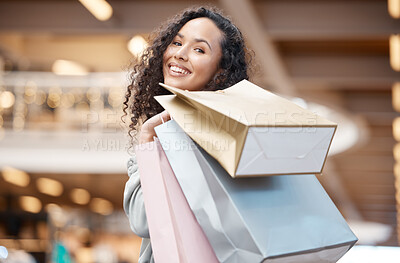 Buy stock photo Happy woman, portrait and customer with shopping bags at mall for indoor purchase, deal or buying spree. Young female person or shopper with smile for gift, present or sale discount at retail store