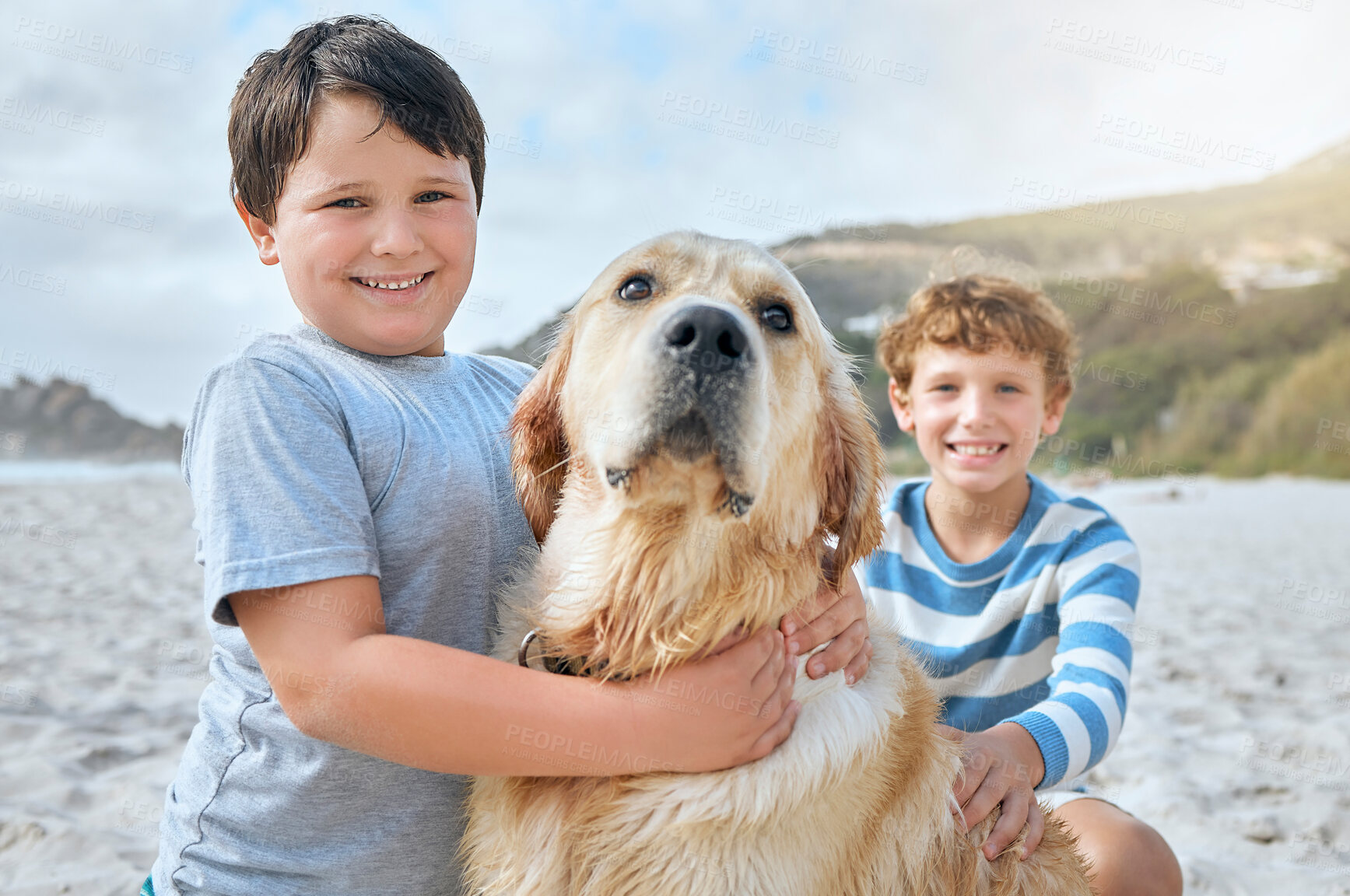 Buy stock photo Boy, children and hug dog at beach in portrait for smile, care or bonding on vacation in summer. Kids, animal or pet golden retriever for love, excited or outdoor for holiday in sunshine with family