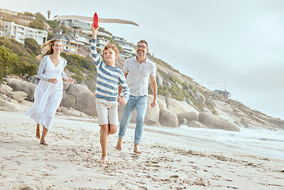 Buy stock photo Parents, boy and plane toys at beach with running, smile or bonding with love on vacation in summer. Dad, mother and child on holiday with airplane, games or playful with family in sunshine by ocean