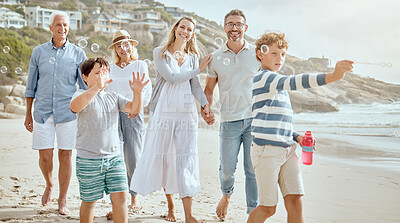 Buy stock photo Family, children and blowing bubbles at beach on walk, smile and bonding on vacation in summer. Parents, grandparents and kids on holiday with soap, games and happy with generations in sunshine