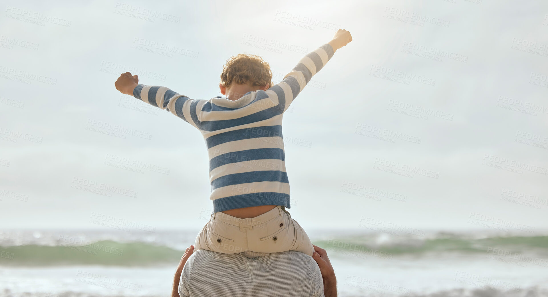 Buy stock photo Father, child and shoulders with back by ocean for airplane, connection or cheers with bonding at beach. Dad, kid and flight with games, love or plane for family on vacation with celebration by waves