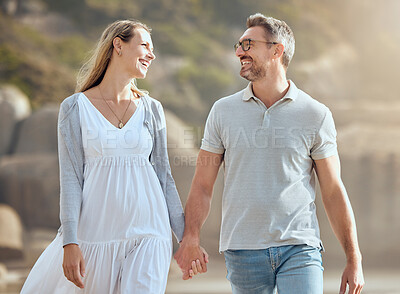 Buy stock photo Happy, couple and outdoor at beach, smile and bonding of people in vacation, man and woman in nature. Summer, walking and holding hands for love in date of anniversary, travel or together in marriage