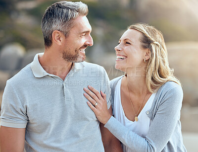 Buy stock photo Laughing, happy man and woman at beach for love, trust and care or support for relationship. Together, couple and smile in nature for date or travel, marriage and joke or humour for outdoor adventure