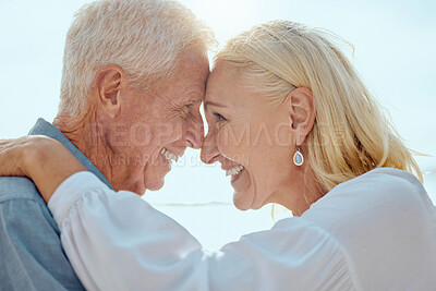 Buy stock photo Senior, couple and happy with love on beach for retirement holiday, travel and romance on anniversary date. Elderly, people and embrace at ocean with smile for bonding, affection and care with relax