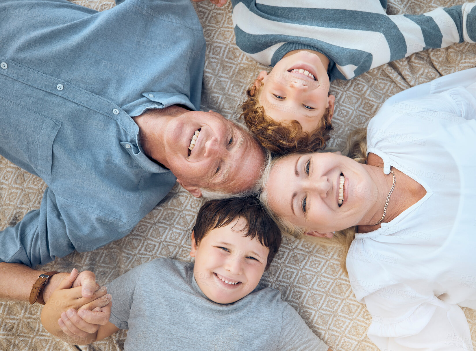 Buy stock photo Above, grandparents and happy with boys on floor on visit for school break, fun and playing. People, home and kids with smile as babysitter or pensioner on retirement with bonding, support and care