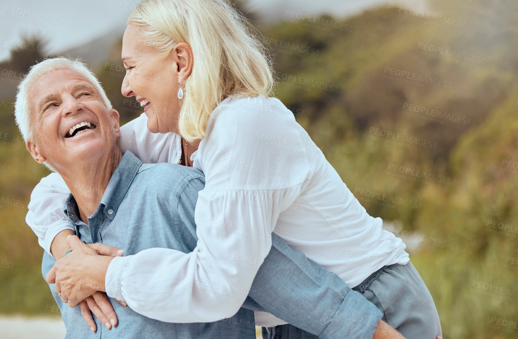 Buy stock photo Smile, senior and couple with piggyback outdoor for fun or goofy activity in nature, love and playful with romance. Man, woman and laugh together with back hug, laughing and silly on retirement trip.