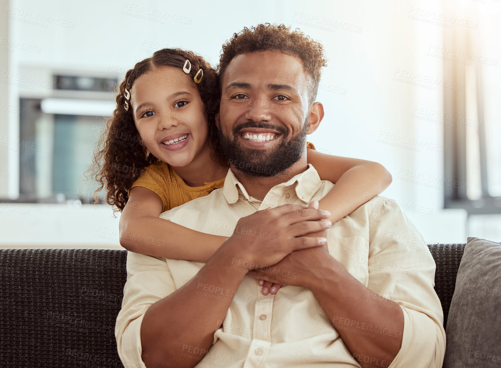 Buy stock photo Hugging, sofa and portrait of child with father for love, care and bonding together in home. Smile, connection and girl kid embracing dad for relax in living room on weekend at house in Colombia.