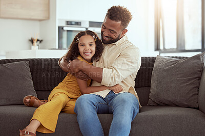 Buy stock photo Hug, sofa and child with father in home for love, care and bonding together on weekend. Smile, connection and girl kid embracing single dad for relax in living room on weekend at house in Colombia.