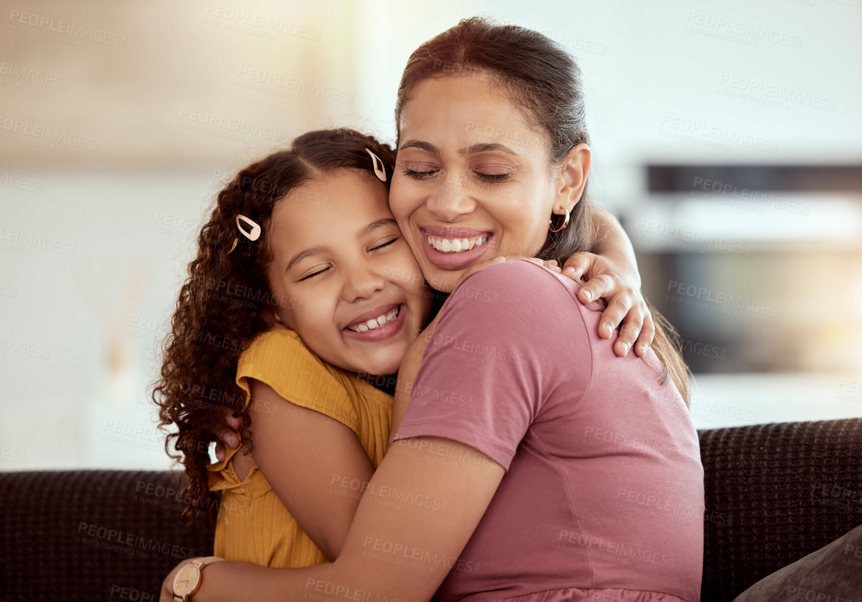 Buy stock photo Connection, sofa and kid hug mother for love, care and bonding together in home. Smile, family and girl child embracing single mom for support and relax in living room on weekend at house in Colombia