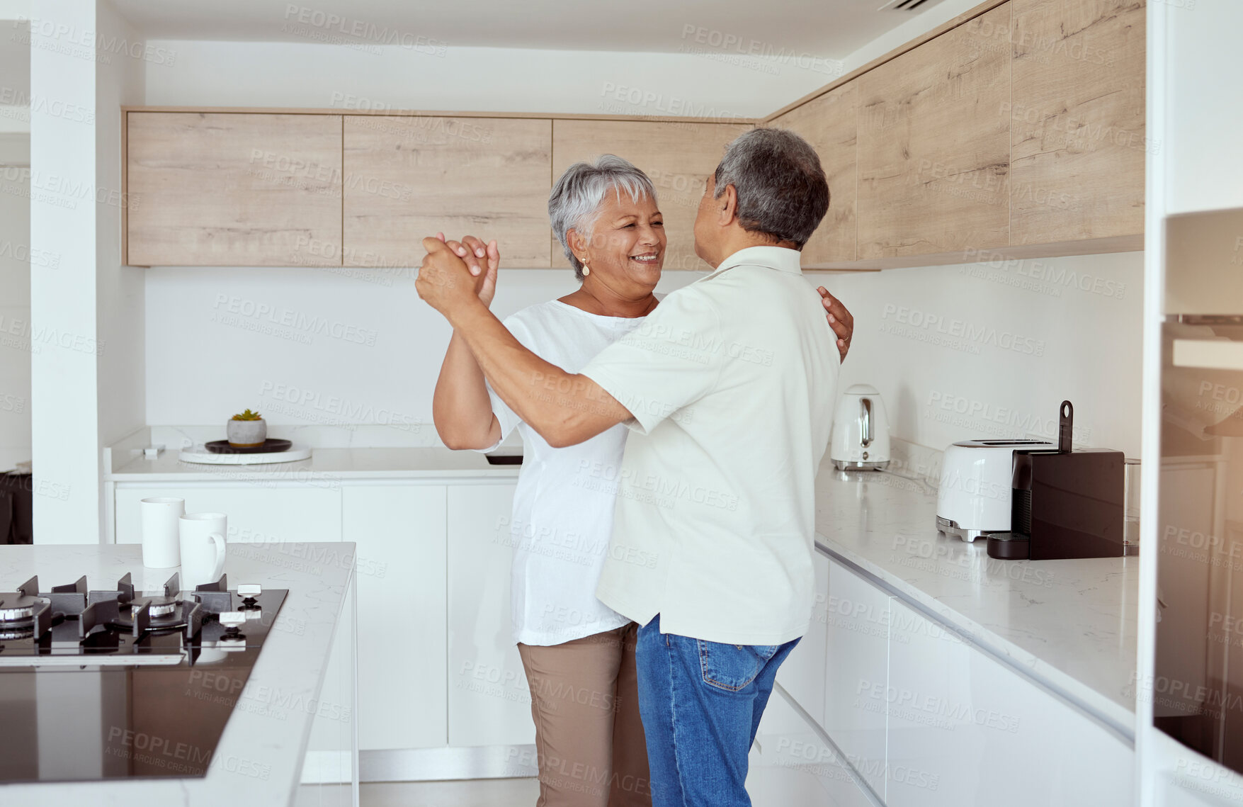 Buy stock photo Happy, senior couple and dance in kitchen with love for marriage, connection and romance in morning. Retirement, man and woman with affection at home for anniversary, commitment or loyalty on weekend