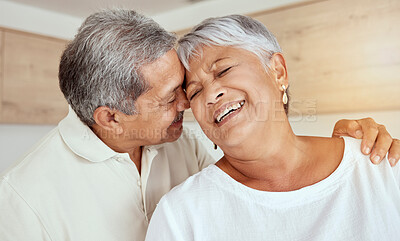 Buy stock photo Kiss, smile and senior couple in retirement with love, support and affection in marriage and home. Embrace, face of happy man and old woman in kitchen together with care, trust and romantic loyalty