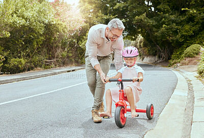 Buy stock photo Father, child and learn to ride bicycle for development, coordination exercise and trust on road. Dad, bonding and teaching young girl in nature for cycling, training wheels and support in lesson