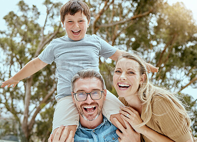 Buy stock photo Portrait, parents and child on shoulder outdoor for playful game, family bonding and support of love in backyard. Smile, woman and man with boy for trust, security and care for hug together in nature