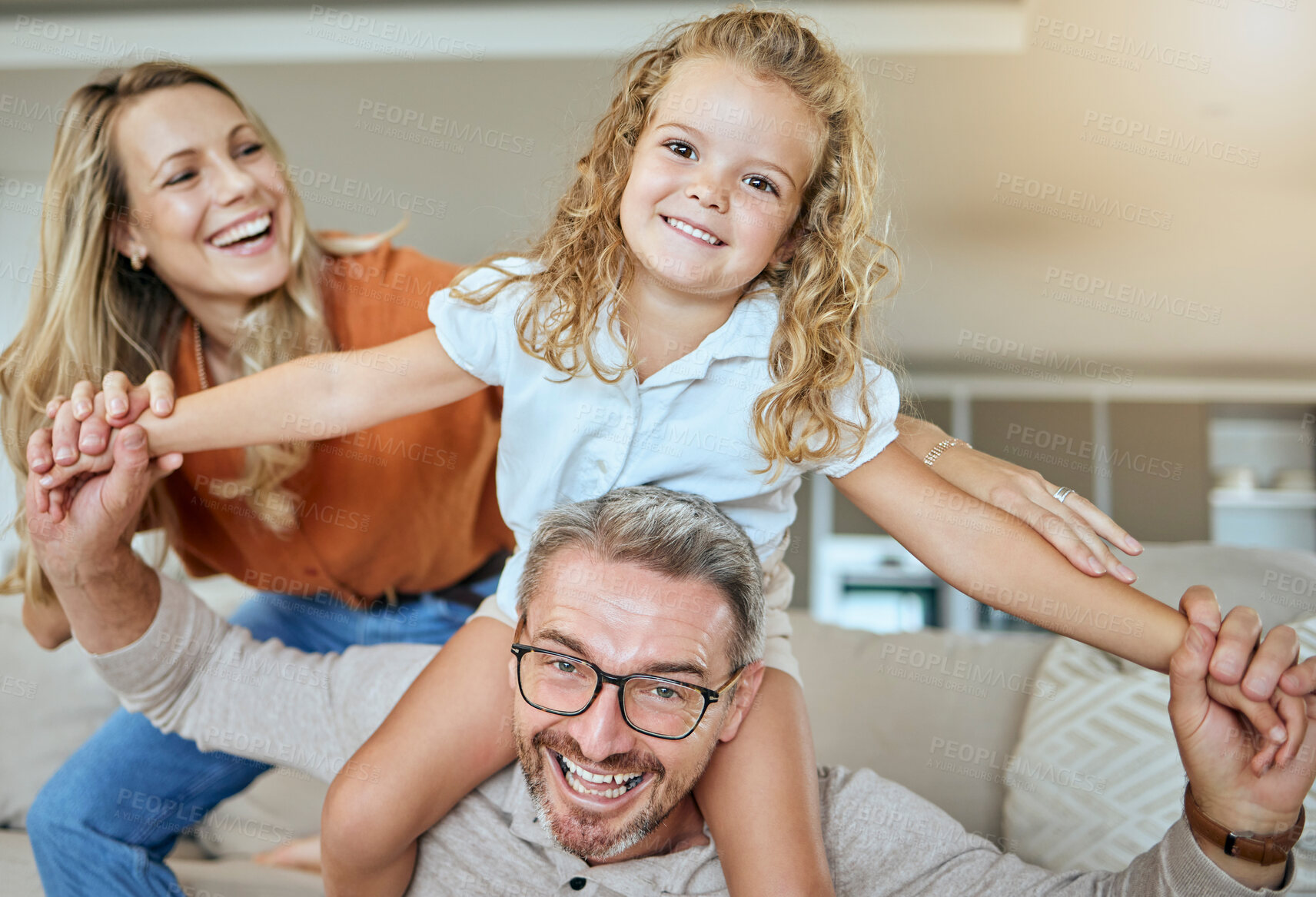 Buy stock photo Happy, family and airplane lounge parents and bonding with daughter on couch, portrait and fun. Home, girl and mom in living room, woman and man with child, playful and games for care and love