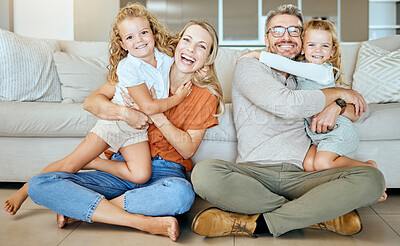 Buy stock photo Happy, hug and portrait in lounge, parents and bonding with family for daughter, girls and fun. Home, kids and mom in living room, woman and man with child, smile and embrace for care and love