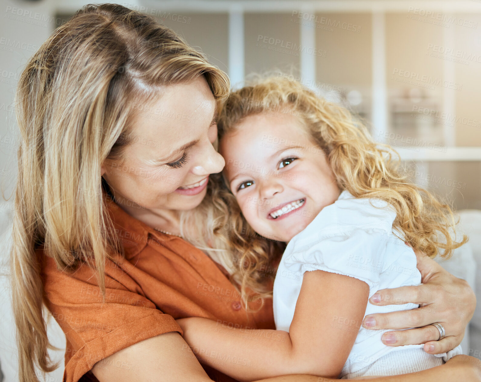 Buy stock photo Portrait, daughter and mom in lounge, happy and bonding with hug for girl, family and care. Home, kid and mother in living room, woman and child with embrace of youth, smile or parent for comfort