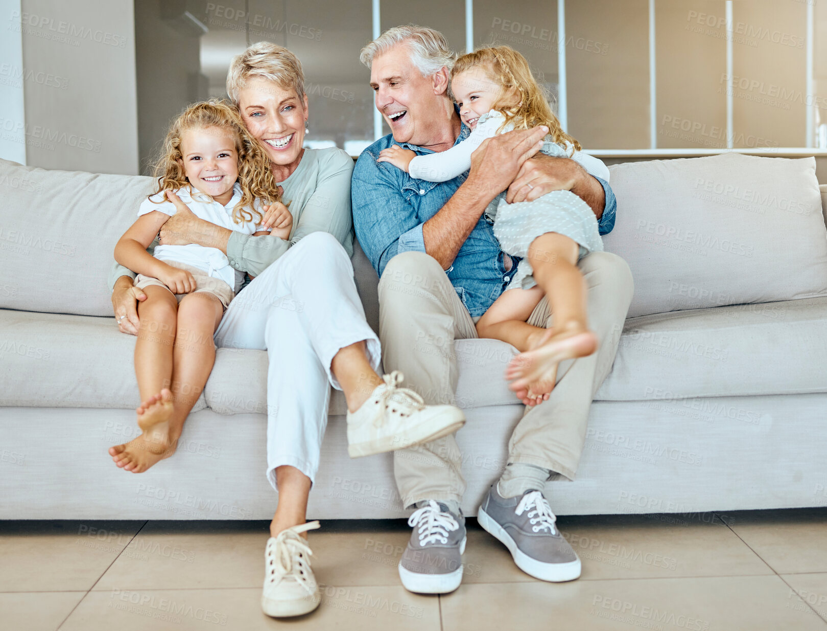 Buy stock photo Happy, children and portrait of grandparents on sofa for care, love or support. Hug, grandma and grandfather with  girls to relax in lounge for family connection, generations or funny sisters in home