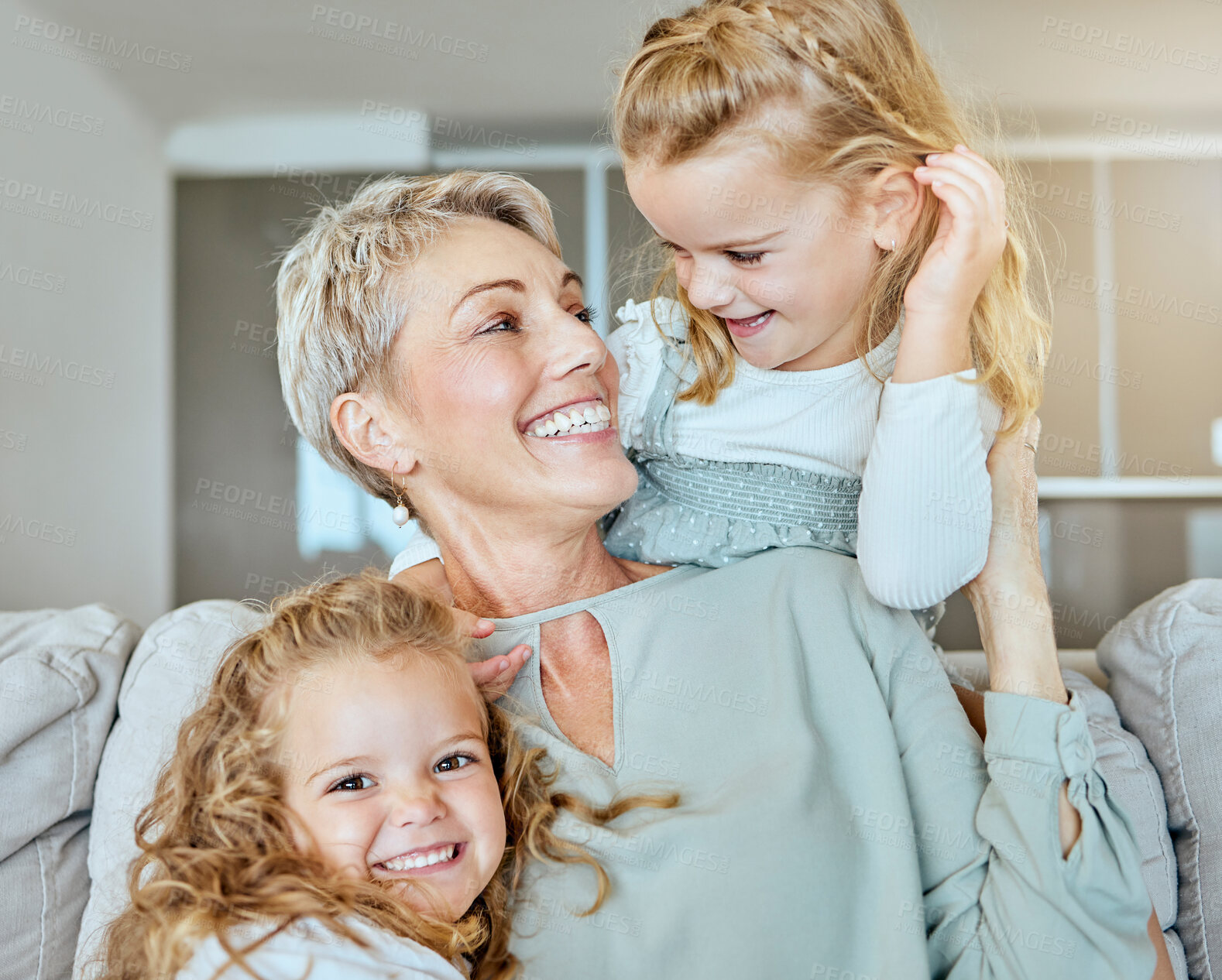 Buy stock photo Happy, senior woman and children with portrait on sofa to relax, family bonding and support for love at house. Smile, grandmother and kids with embrace for trust, security and care of hug together