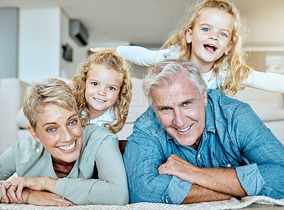 Buy stock photo Grandparents, family and portrait on living room floor for bonding, relax and together on weekend. Elderly people, children and face with smile in house for love, support and growth or development