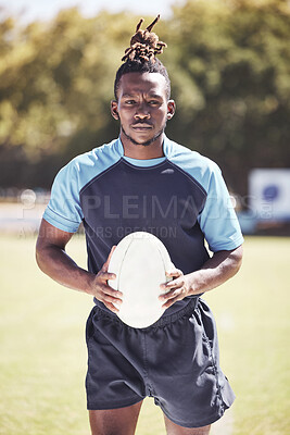 Buy stock photo Portrait, rugby player and black man on field, ball and serious for game, scrum half and fitness. African person, outdoor and athlete with wellness, training and match with attitude and confidence
