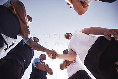 Buy stock photo Rugby, team and handshake of players with below, confidence and pride in competitive game. Fitness, sports and teamwork, proud men ready for match, workout or tournament on field at health club
