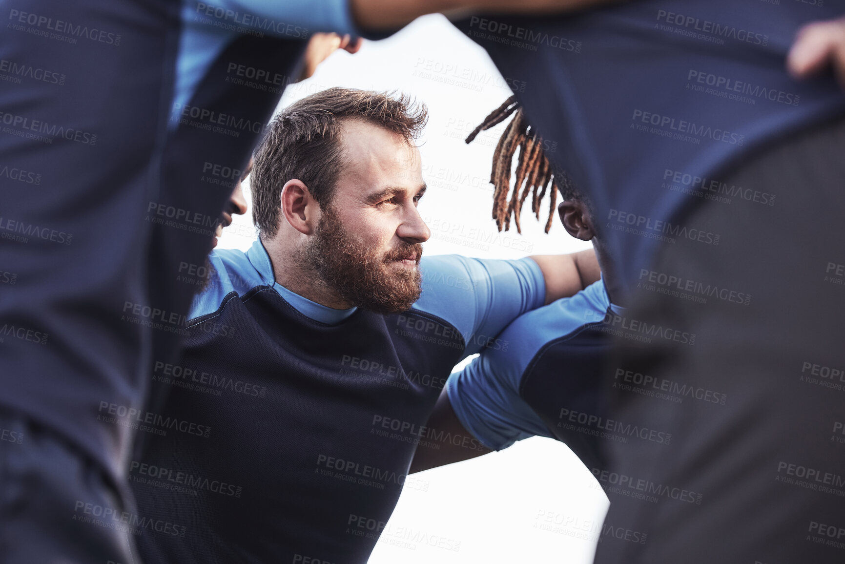 Buy stock photo Rugby, men and huddle of team with pride, motivation and smile in competitive game. Collaboration, sports and teamwork with diverse players, below and ready for match or tournament at fitness club