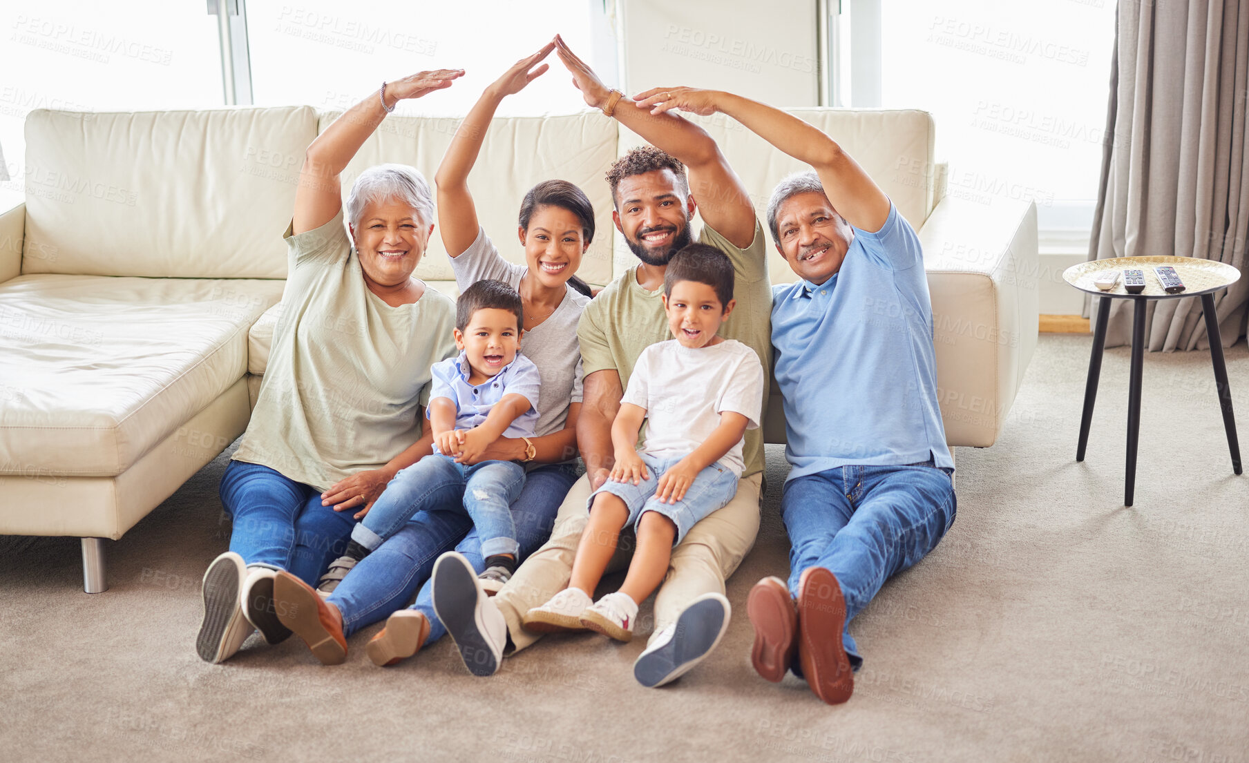 Buy stock photo Family, portrait and hands with roof for protection, real estate insurance or mortgage cover on floor. People, parents and grandparents with children for home security, property investment or support