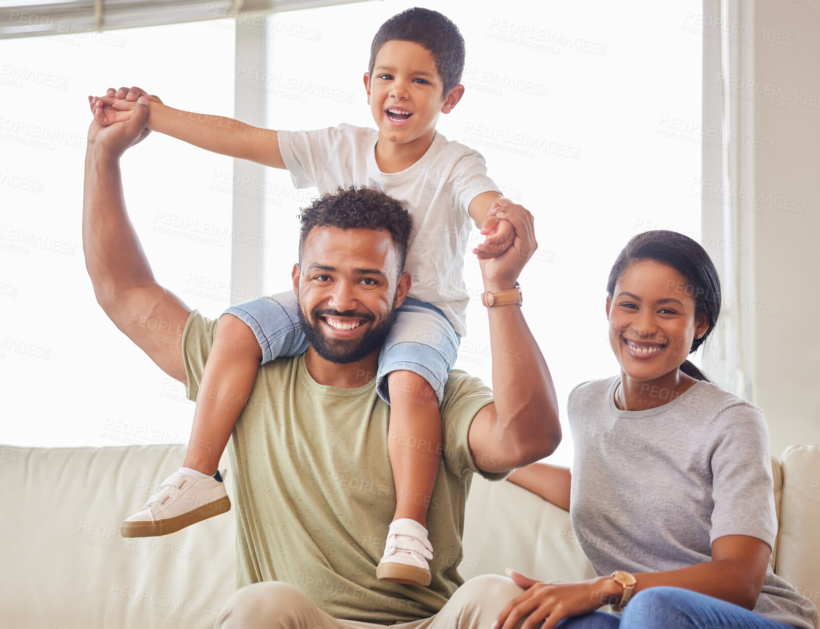 Buy stock photo Plane, shoulders and portrait with family on sofa in living room of home together for bonding, fun or love. Balance, fantasy or smile with mother, father and son in apartment for child development