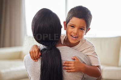 Buy stock photo Mom, boy portrait and hug with love for relationship trust, security and bonding together in home. Mother back, happy son and embrace with care in lounge for safety, support and family connection