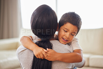 Buy stock photo Mom, boy and love hug in home with relationship trust, security and bonding together for family connection. Mother back, happy son and embrace in lounge for safety, support and celebrate mothers day