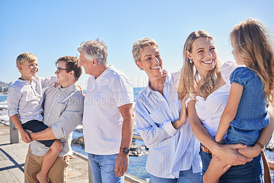 Buy stock photo Family, talk and generations for love on beach, promenade and hug for support in outdoor. Parents, grandparents speaking and children for embrace on vacation, bonding and holiday for seaside freedom