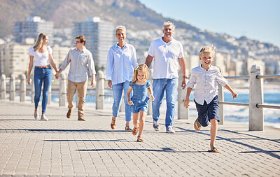 Buy stock photo Family, children and running for fun on beach, promenade and generations for support in outdoor. Parents, grandparents and kids for freedom on vacation, love and holiday for holding hands in nature