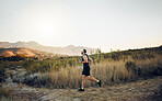 Man running in nature, marathon fitness training exercise and healthy sunrise cardio workout. Sports runner, racing on hiking path and working out to for athletic speed or energy in race competition 