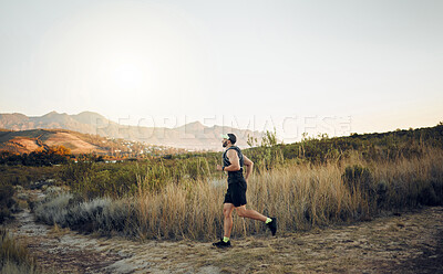 Buy stock photo Man running in nature, marathon fitness training exercise and healthy sunrise cardio workout. Sports runner, racing on hiking path and working out for athletic speed or energy in race competition 