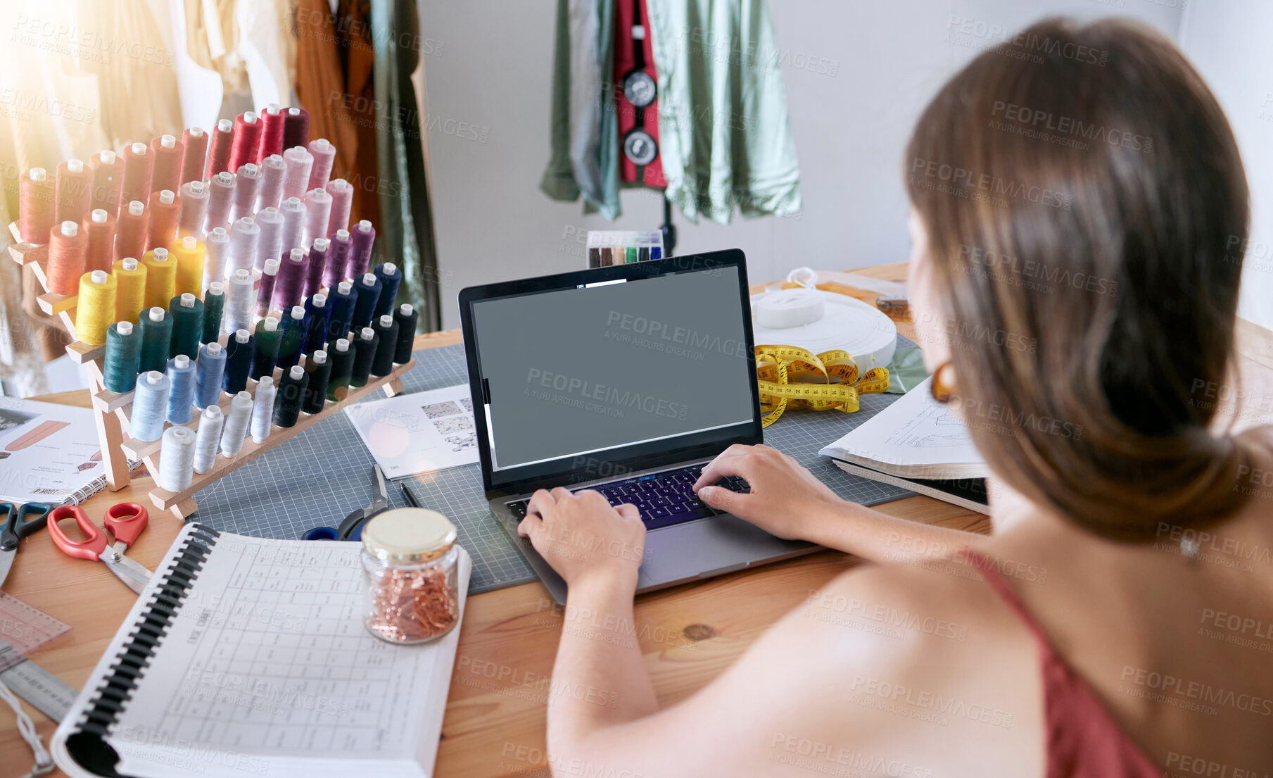 Buy stock photo Fashion, clothes and digital designer woman working on a computer planning clothing production. Online, web and textile design of a seamstress, tailor and stylist employee in a creative work studio