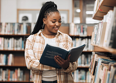 Buy stock photo Black woman, library and reading for knowledge, education and relax. Nigerian female, girl and student read book, bookstore and research for task, smile and enjoy free time with literature and study.