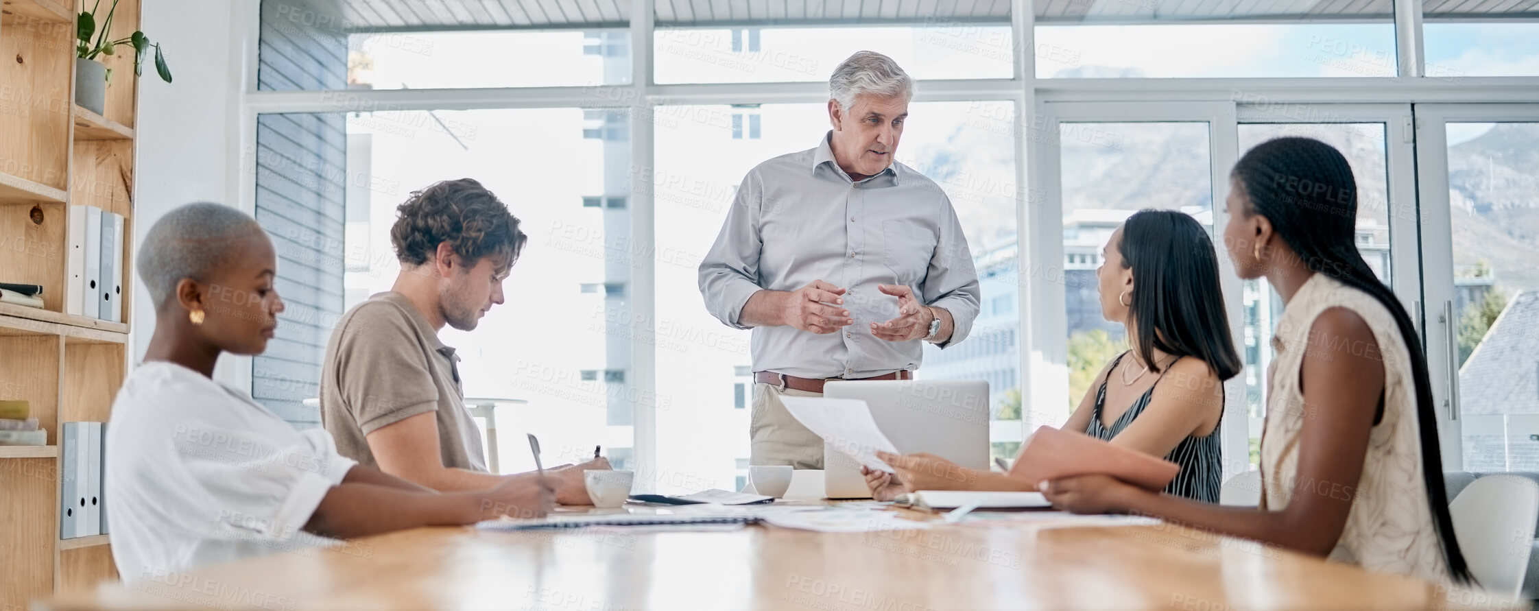 Buy stock photo Meeting, coaching and education with a business man manager and his team in the boardroom for planning or strategy. Leadership, management or teamwork with a senior male leader and employee group