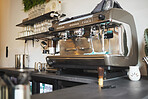 Closeup cafe, coffee and machine equipment in small business, beverage shop or retail. Backgrounds of barista services, drinks machinery and restaurant store of premium espresso, cappuccino and latte