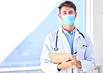 Portrait, covid and mockup with a doctor man writing on a clipboard in a hospital for insurance. Medical, healthcare and checklist with a male medicine professional completing documents for admin