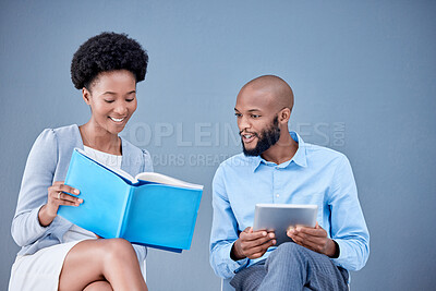 Buy stock photo Black people, business and tablet in research with textbook for information or knowledge against a studio background. Happy African American employee man and woman with touchscreen and reading book