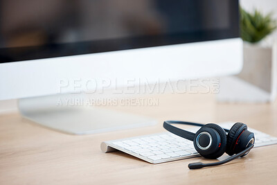 Buy stock photo Call center help desk, computer or headset for communication for telecom customer services. Keyboard, background or crm office workplace for technical support, telemarketing sales or consulting job