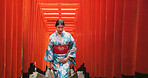 Woman, Japanese and walking at temple in traditional kimono or Tokyo for worship, respect or faith. Female person, shinto building and stairs for heritage peace or outdoor journey, travel or history